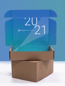 blue ombre peloton homecoming mailer box with the year 2021 on the inside